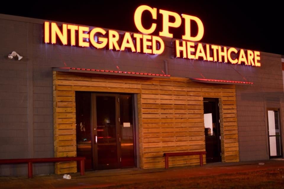 CPD Integrated Healthcare clinic exterior in Durant at dusk, with the illuminated sign